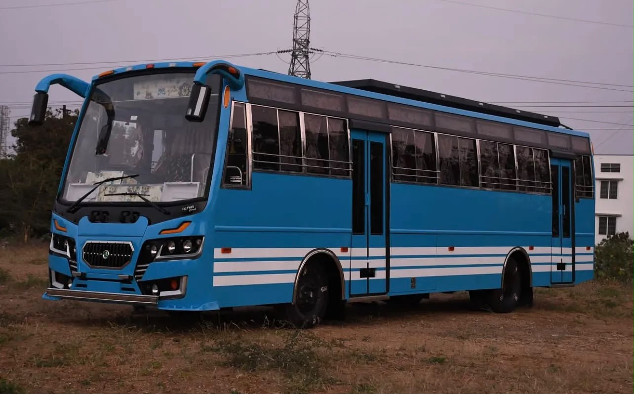 Blue staff bus with custom exterior stripe design fabricated by Alfha Coach Builders in Karur, Tamil Nadu