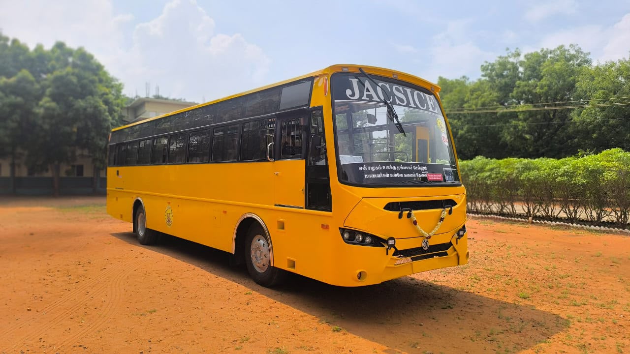 Yellow JACSICE college bus body built by Alfha Coach Builders, Karur